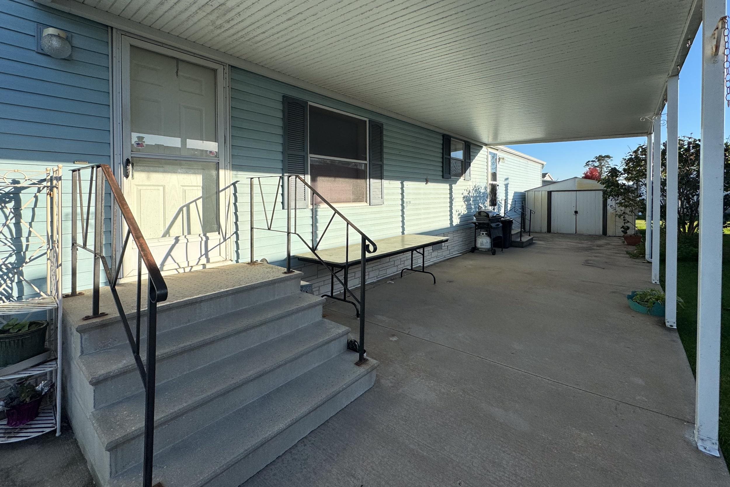 1202 Spring Circle Belvidere, IL 61008 - Photo 13 of 18 a view of an empty room with wooden floor and furniture