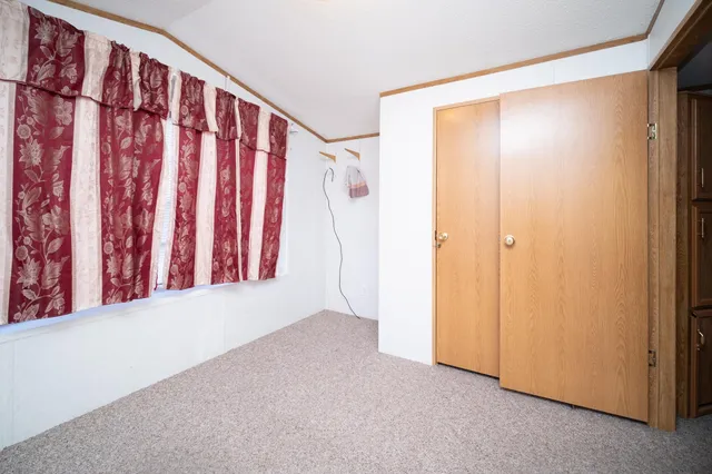 a view of a room with wooden walls