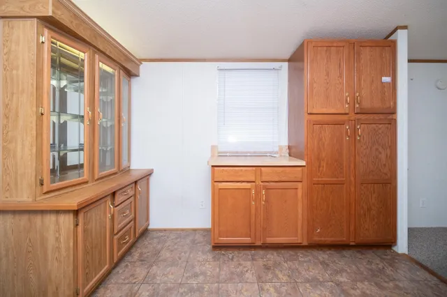a view of a refrigerator in kitchen