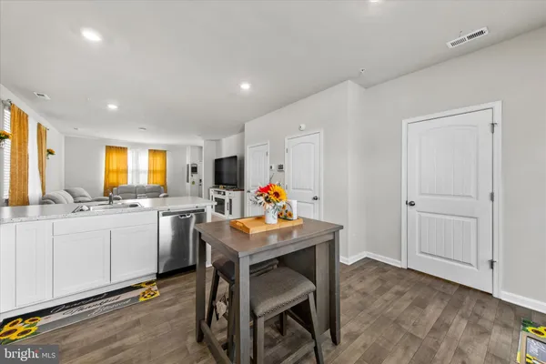 a very nice looking dining room with a table and chairs