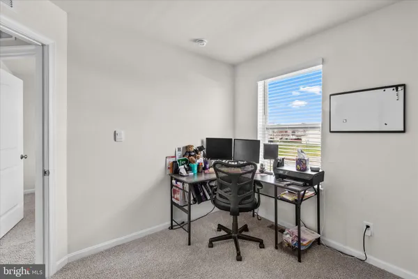 a workspace with furniture and a window