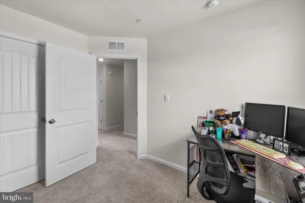 a view of a workspace with furniture