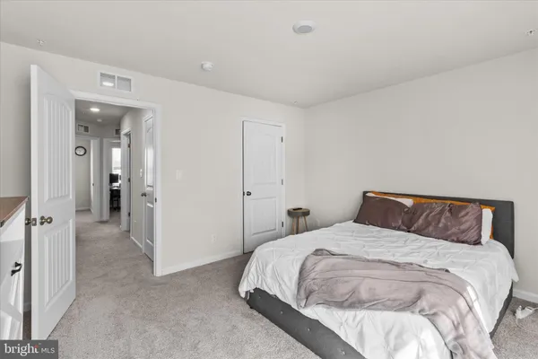 a bedroom with a bed and closet