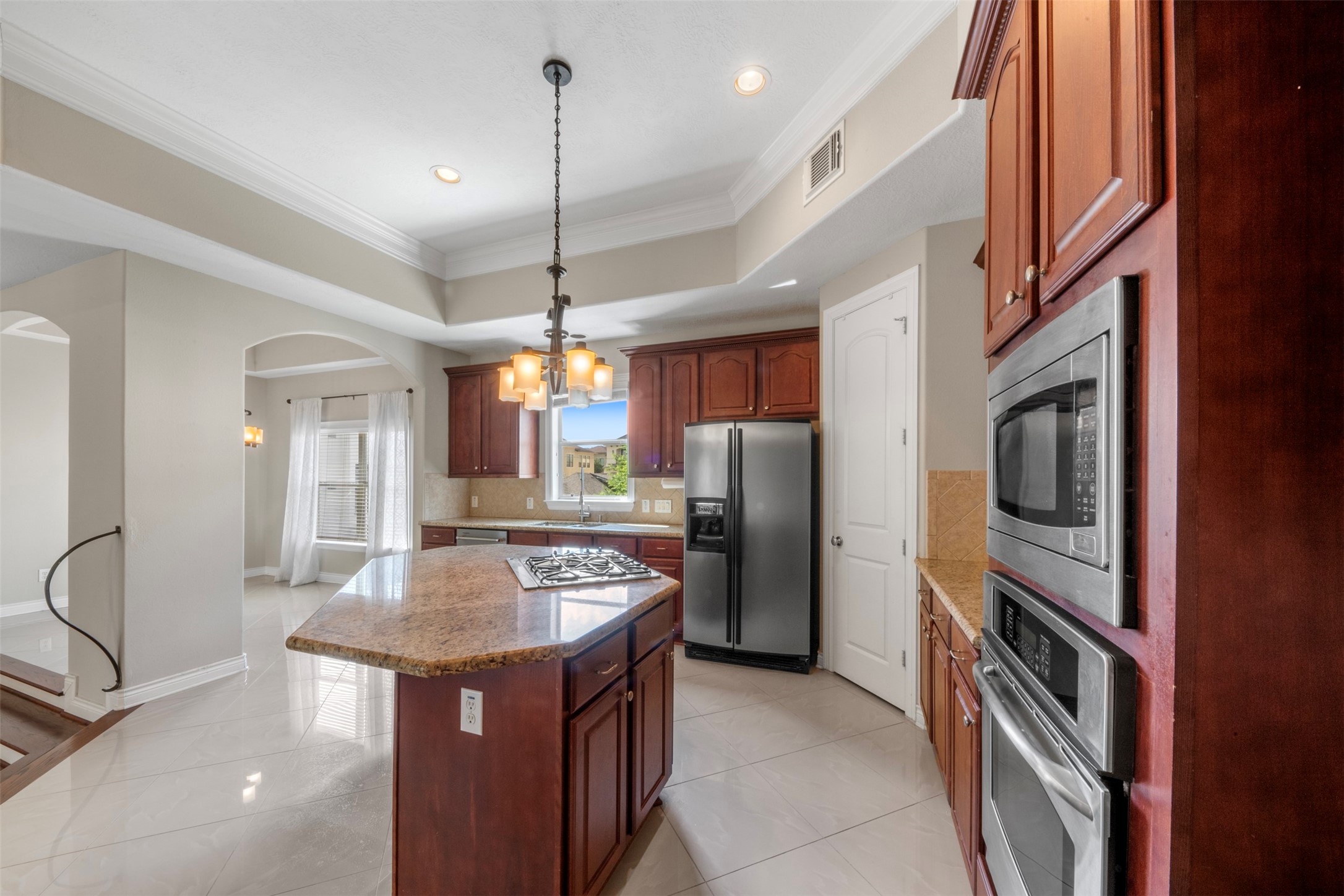 6524 Calder Street Houston, TX 77007 - Photo 11 of 28 a kitchen with refrigerator a sink and cabinets