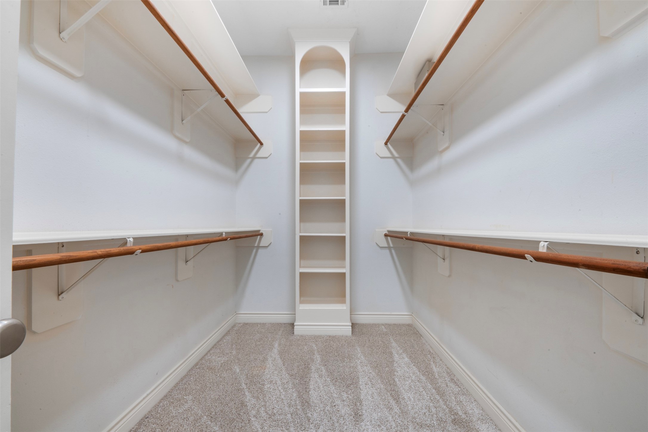 6524 Calder Street Houston, TX 77007 - Photo 26 of 28 a view of walk in closet with empty racks