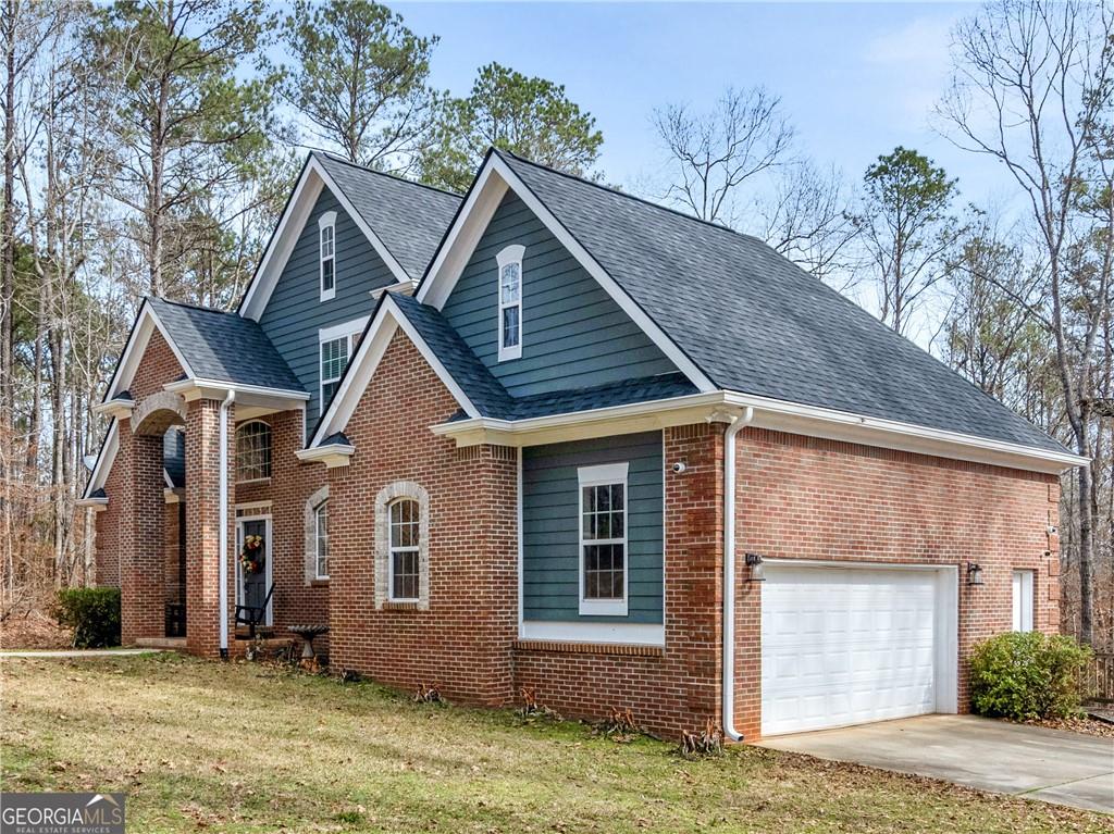 355 Parker Road Covington, GA 30014 - Photo 56 of 60 a front view of a house with a yard