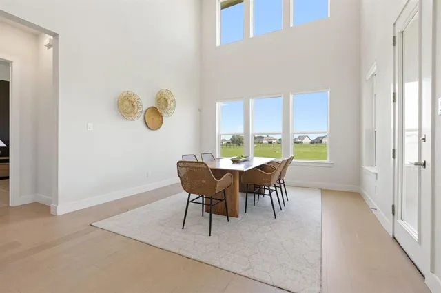 a view of a dining room with furniture and a window