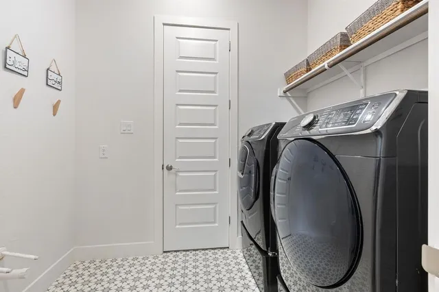 a utility room with dryer and washer