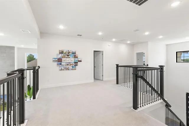 a view of a hallway with a livingroom
