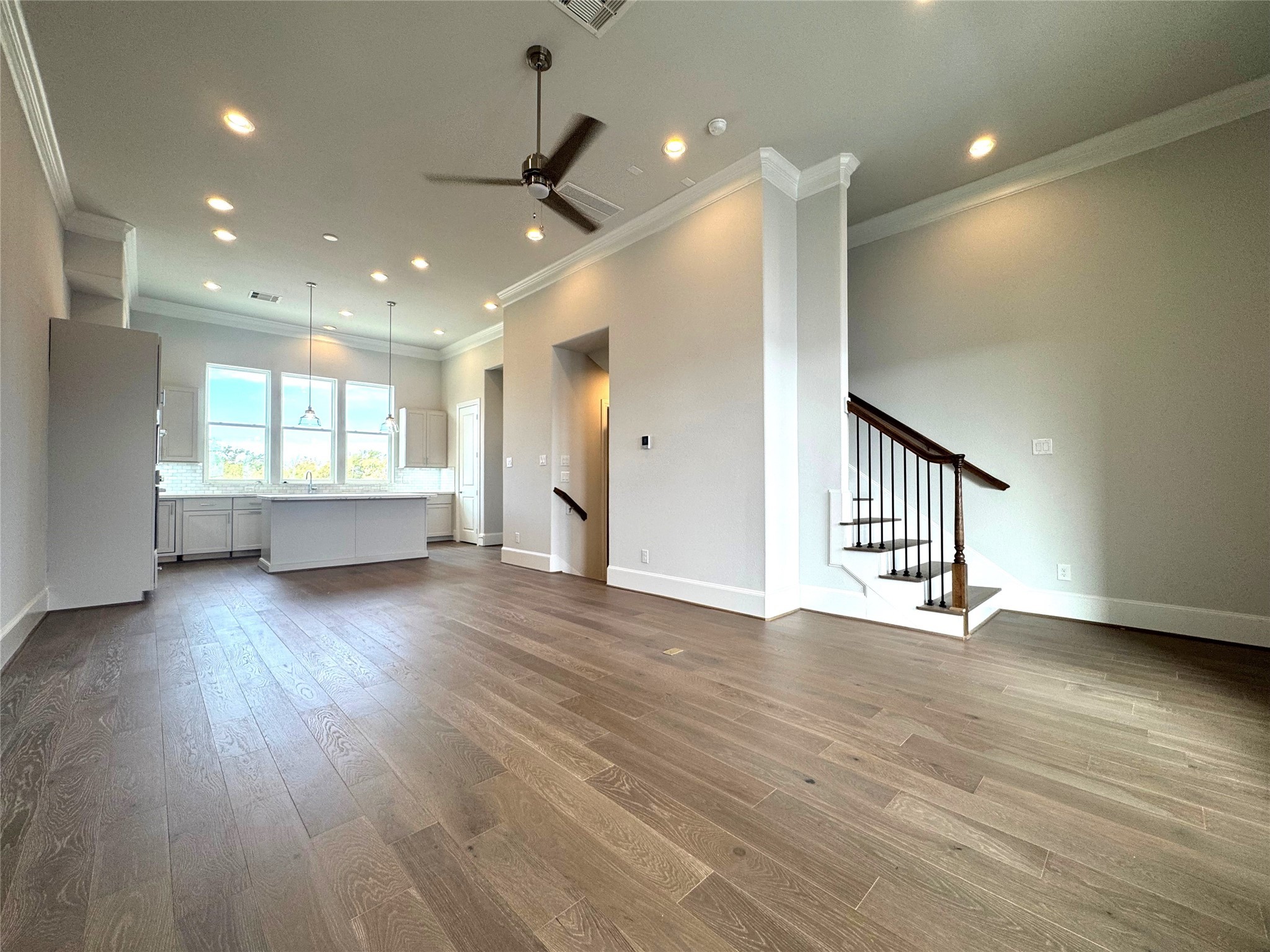 2747 Providence Street Houston, TX 77020 - Photo 4 of 16 a view of an empty room with a window and wooden floor