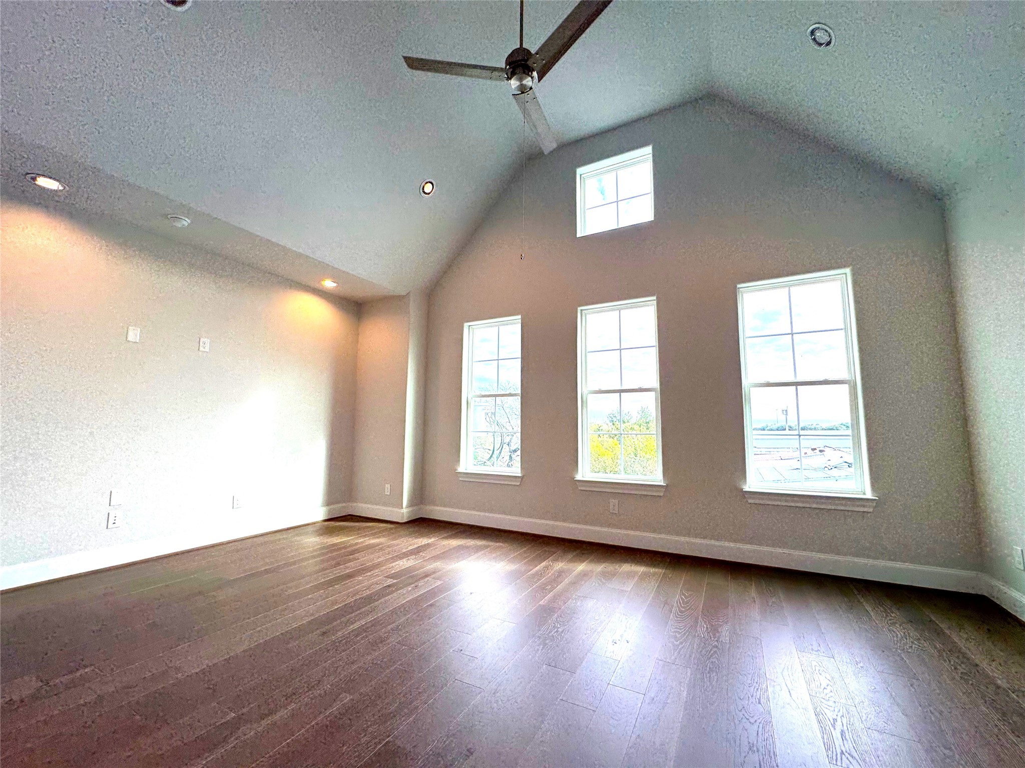 2747 Providence Street Houston, TX 77020 - Photo 7 of 16 an empty room with wooden floor and windows