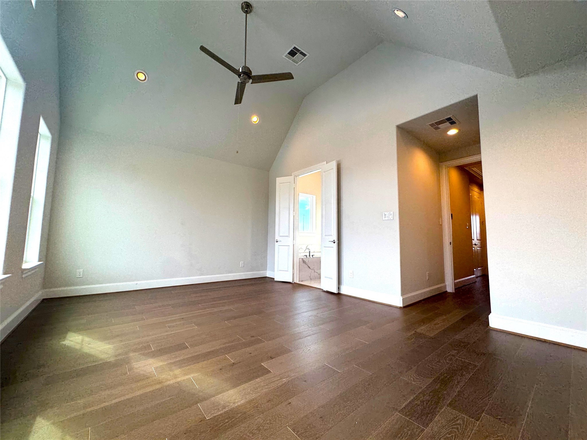 2747 Providence Street Houston, TX 77020 - Photo 8 of 16 an empty room with wooden floor and windows