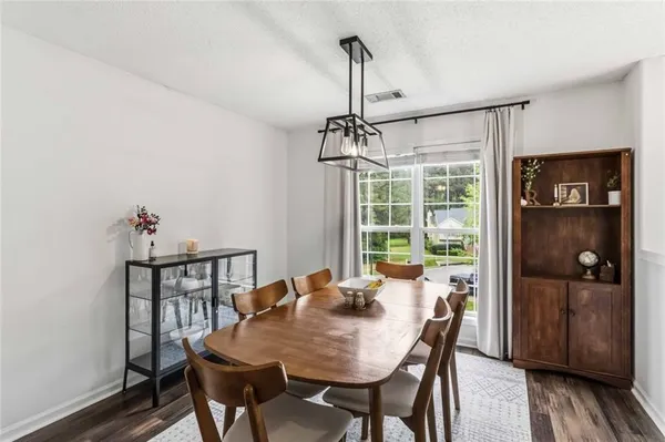 a view of backyard with large tree