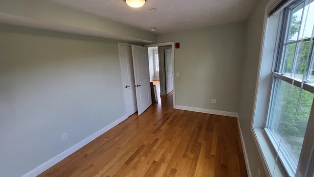 a view of wooden floor in an empty room
