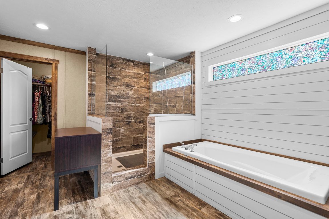 498 William Pettus Road Maxwell, TX 78656 - Photo 12 of 27 a bathroom with a bathtub and a shower