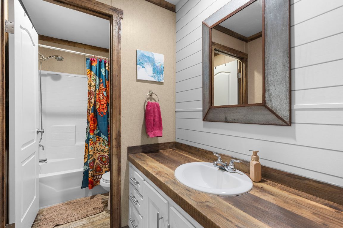 498 William Pettus Road Maxwell, TX 78656 - Photo 17 of 27 a bathroom with a sink and a mirror