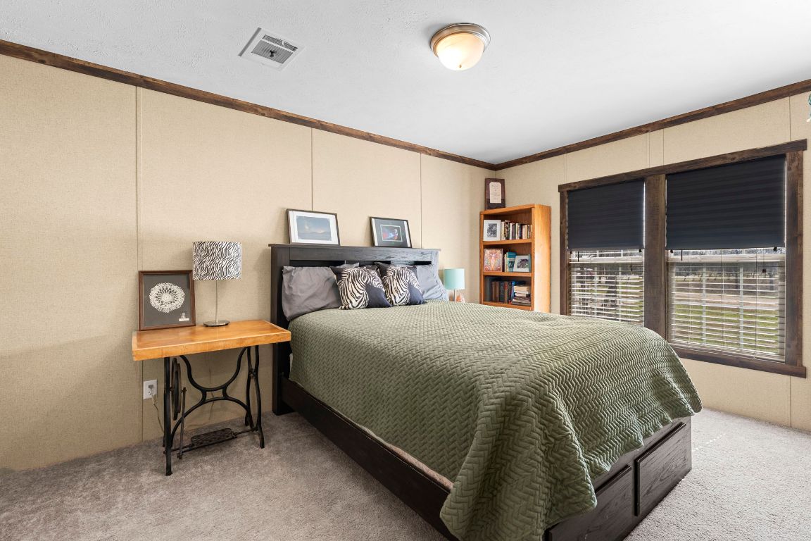 498 William Pettus Road Maxwell, TX 78656 - Photo 18 of 27 a bedroom with a bed and a large window