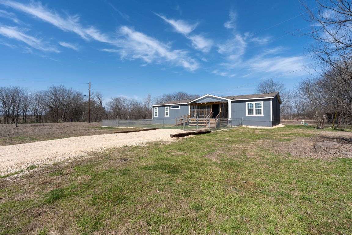 498 William Pettus Road Maxwell, TX 78656 - Photo 19 of 27 a front view of a house with a yard