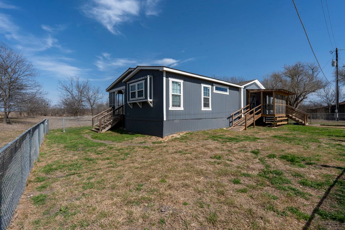 498 William Pettus Road Maxwell, TX 78656 - Photo 21 of 27 a front view of a house with a yard