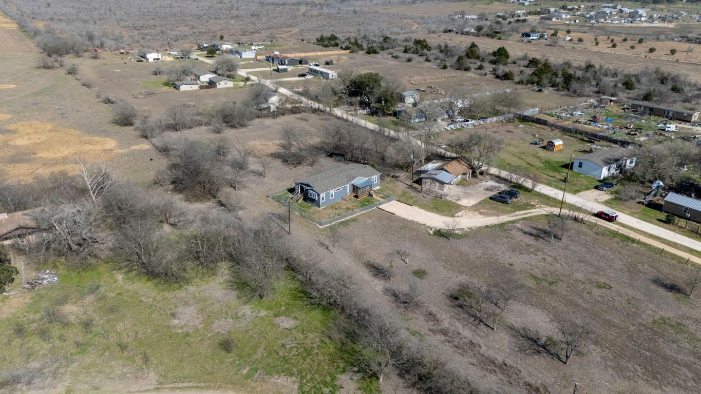 498 William Pettus Road Maxwell, TX 78656 - Photo 24 of 27 an aerial view of residential houses with outdoor space