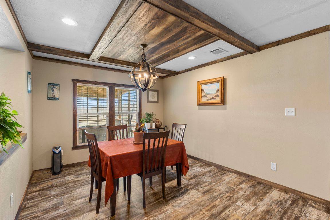 498 William Pettus Road Maxwell, TX 78656 - Photo 4 of 27 a view of a dining room with furniture window and wooden floor