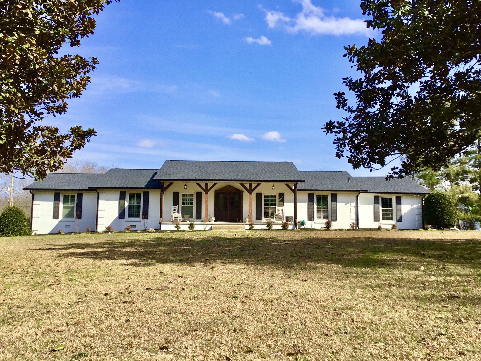 401 Bumpas Road Lawrenceburg, TN 38464 - Photo 1 of 58 a front view of a house with a yard