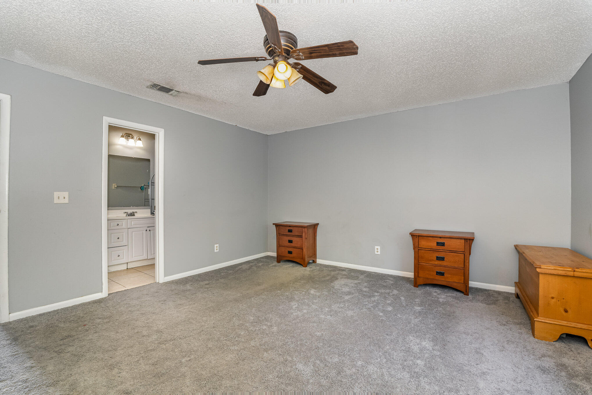 3118 Manor Drive Northeast Palm Bay, FL 32905 - Photo 13 of 22 an empty room with closet and windows