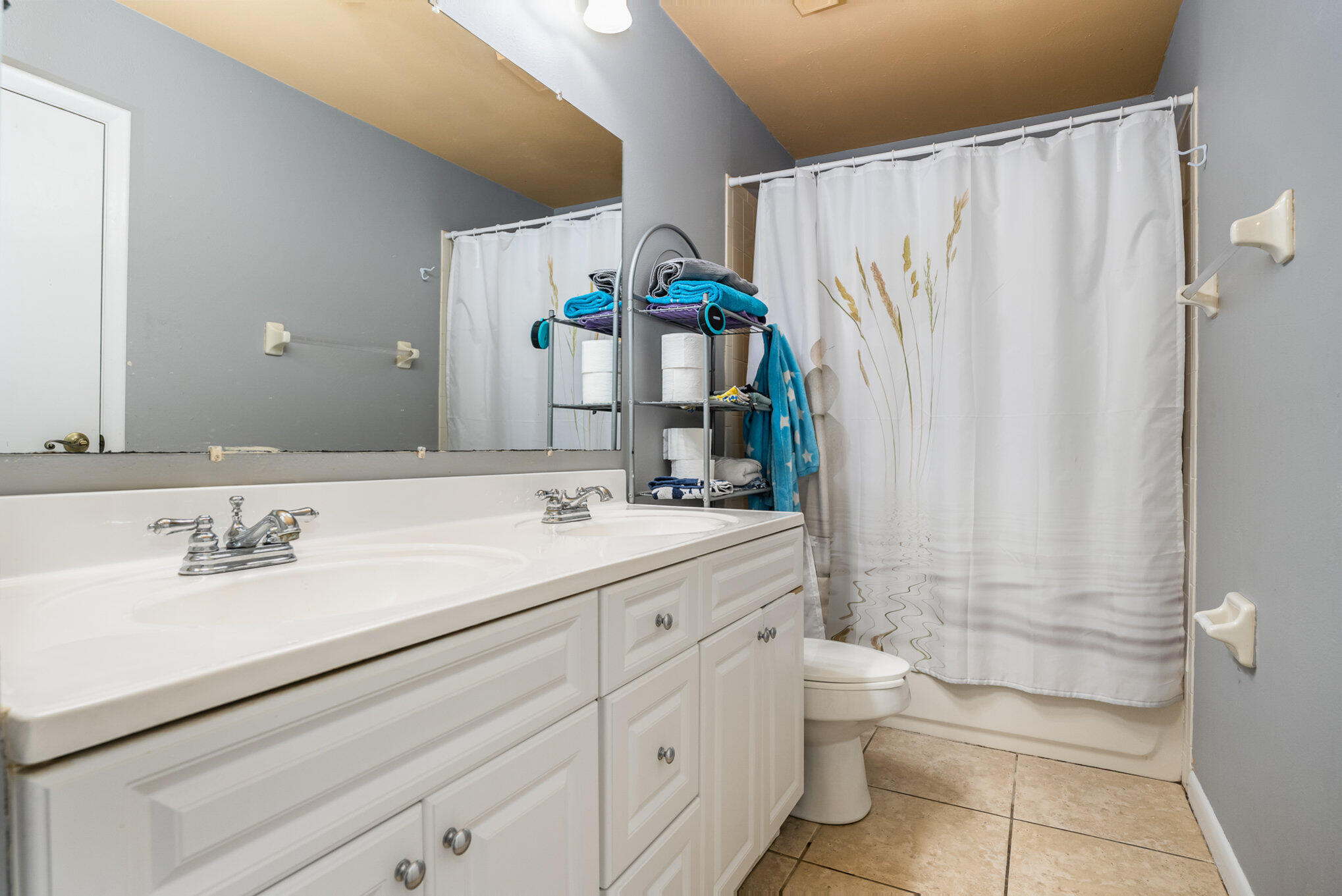 3118 Manor Drive Northeast Palm Bay, FL 32905 - Photo 14 of 22 a bathroom with a double vanity sink toilet and shower
