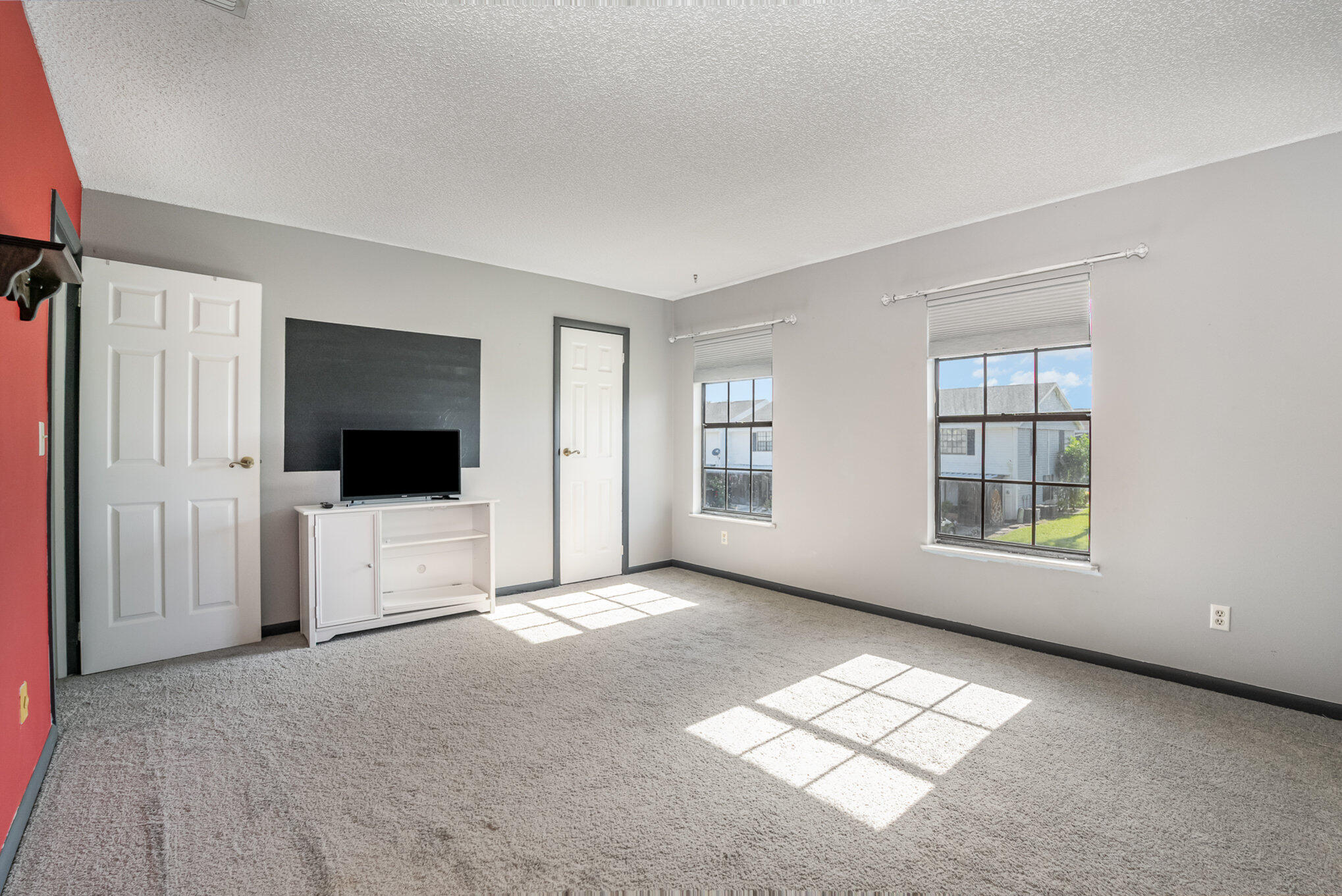 3118 Manor Drive Northeast Palm Bay, FL 32905 - Photo 17 of 22 a living room with furniture and a flat screen tv