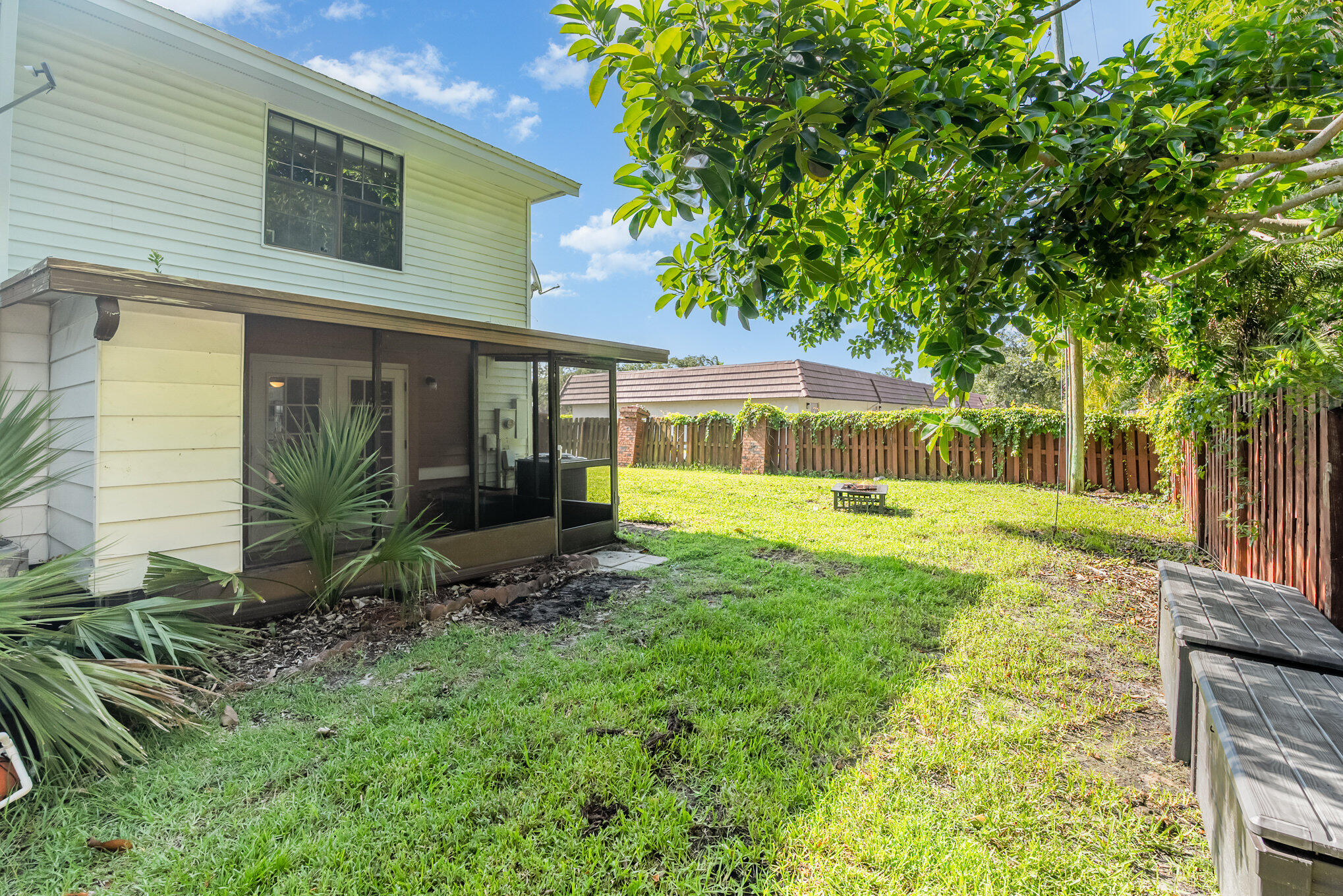 3118 Manor Drive Northeast Palm Bay, FL 32905 - Photo 21 of 22 a view of a house with backyard and sitting area
