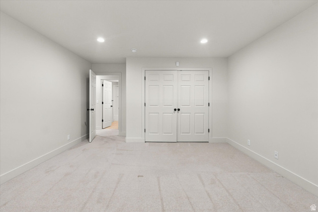 689 Apple Drive Logan, UT 84321 - Photo 30 of 52 Neutral-toned room featuring light gray carpet flooring and white baseboards
