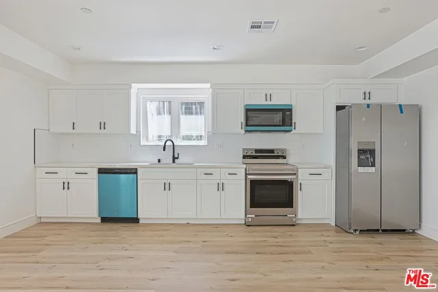 a view of a livingroom with wooden floor