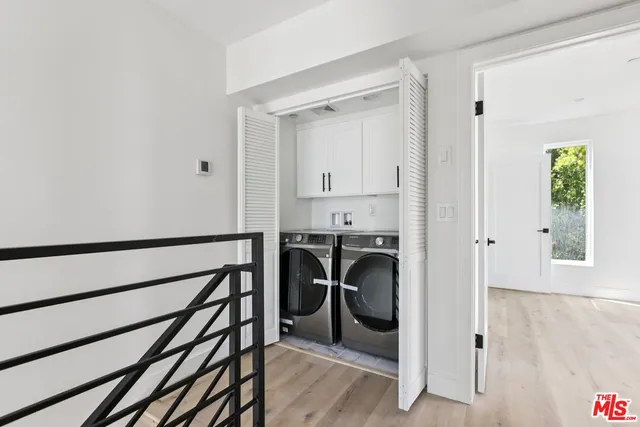 a kitchen with stainless steel appliances a refrigerator stove and oven