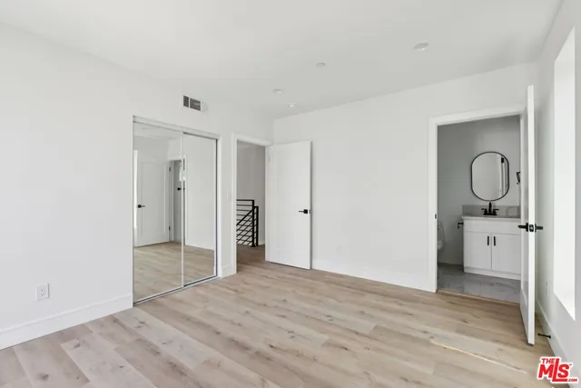 a kitchen with granite countertop a stove top oven and sink