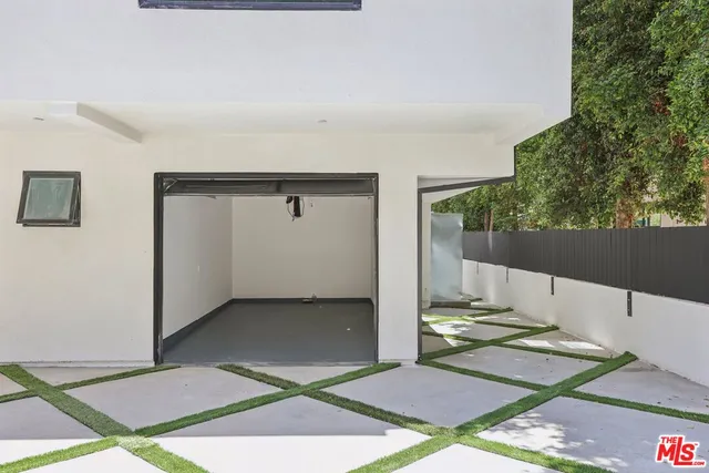 a view of a house with wooden deck