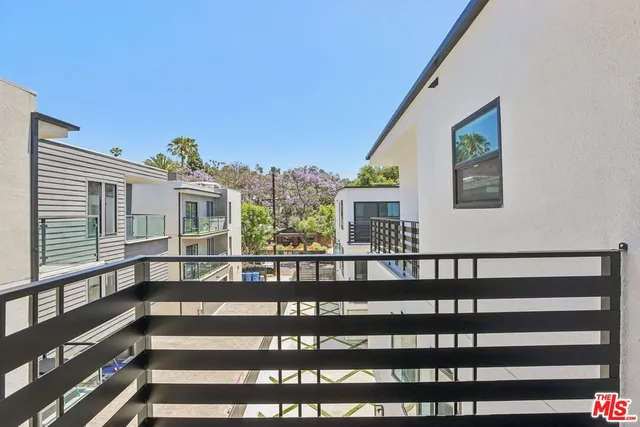 a kitchen with stainless steel appliances a refrigerator and cabinets