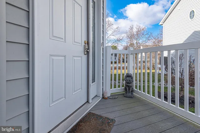 aerial view of a house with a big yard and large trees