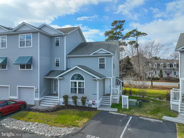 an aerial view of a house with a lake view