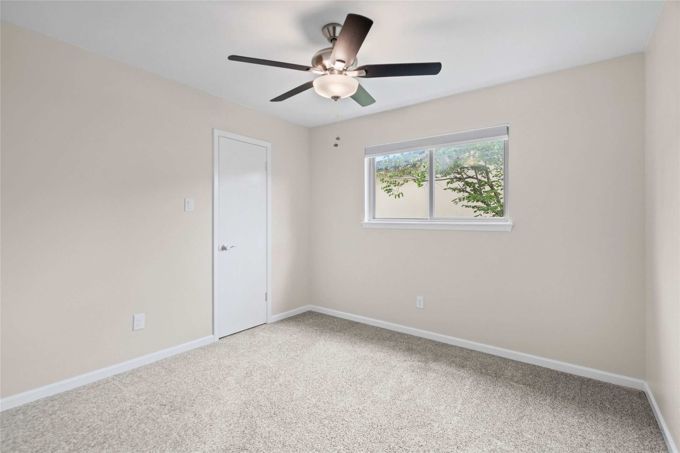 810 Stillhouse Spring Round Rock, TX 78681 - Photo 12 of 18 A well-lit bedroom with fresh carpeting offers a serene and comfortable living space.