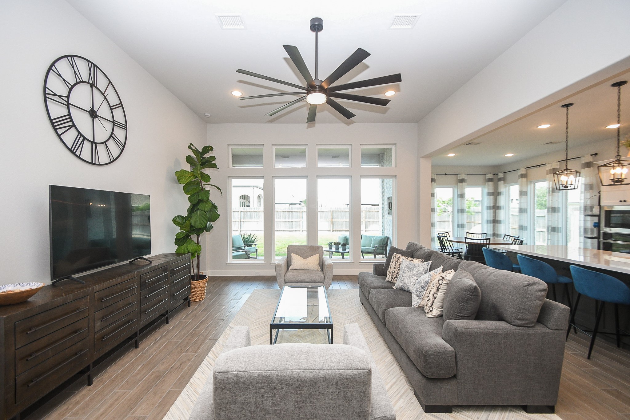 30314 Brook Point Fulshear, TX 77441 - Photo 7 of 38 Open concept living with a wall of windows overlooking backyard