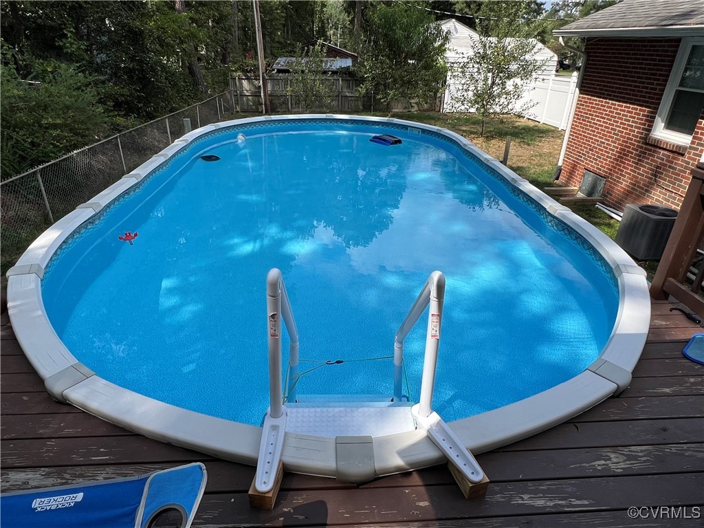 9712 Esmont Road Henrico, VA 23228 - Photo 17 of 21 View of swimming pool featuring a deck