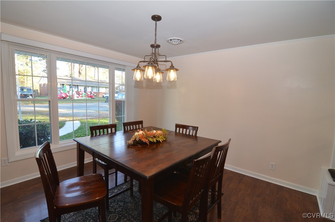 9712 Esmont Road Henrico, VA 23228 - Photo 9 of 21 Dining room with dark wood flooring, crown molding