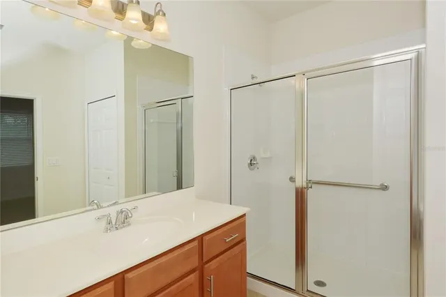 a view of a big room with a ceiling fan and a ceiling fan