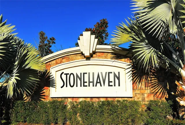 a view of a swimming pool with an outdoor space and seating area