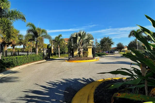a view of swimming pool with sitting area and garden