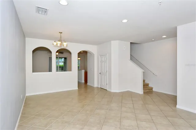a view of entryway with staircase and a livingroom view