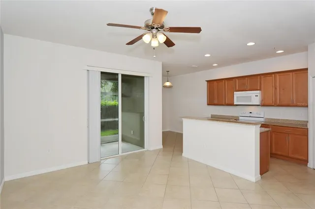 a kitchen with a refrigerator and a sink