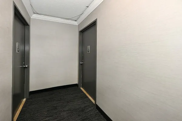 a view of hallway with wooden floor