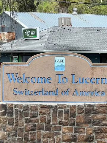 a view of a backyard with large trees