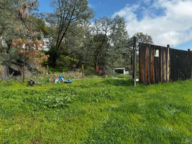 a view of a park with swings and slides